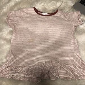 Striped tshirt with a ruffled bottom.